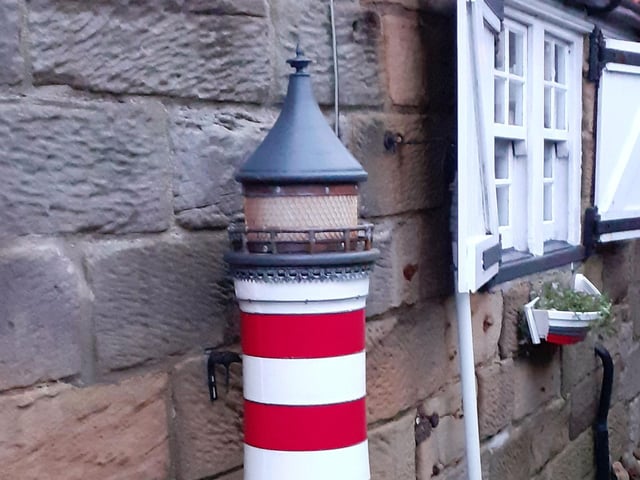 A quirky street scene in Robin Hood's Bay, by Jane Ellis.