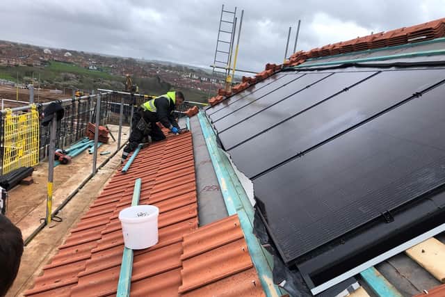 Solar panels being installed at one of the properties on Whitby's Eskdale View.