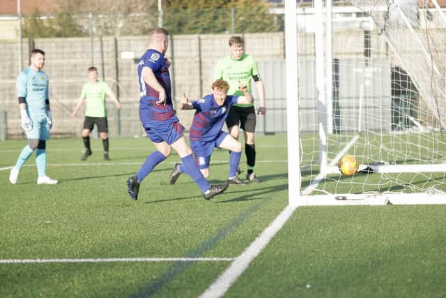 The hosts score one of their eight goals in the East Riding FA Junior Country Cup third round win.