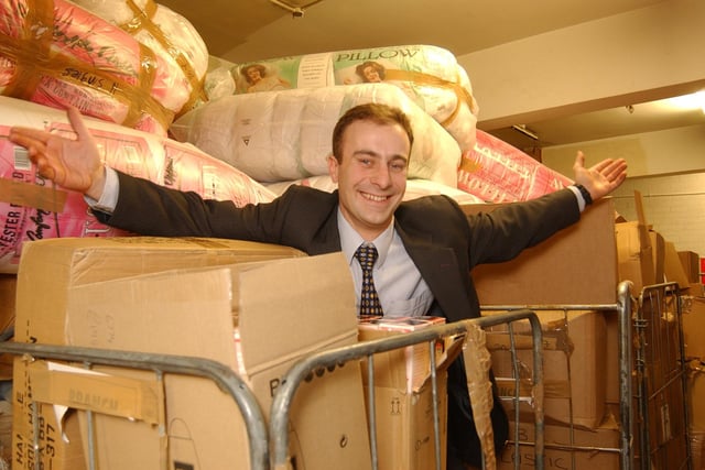 Matthew Boyes, the new manager in 2006, in the packed stockroom, looks forward to the traditional winter sale.