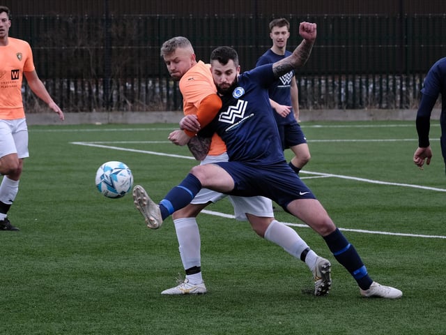 Sean Exley puts a Haxby player under pressure
