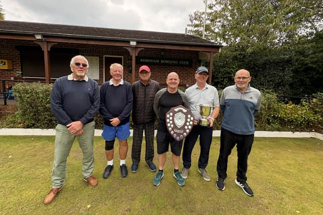 Barrie Watson and Russ Turner show off their trophies at Borough BC, presented by president Pete Hodgson.
