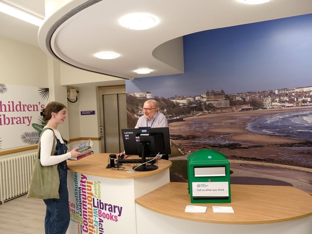 Milly Newham with staff member Mark Glossop at the new reception area.