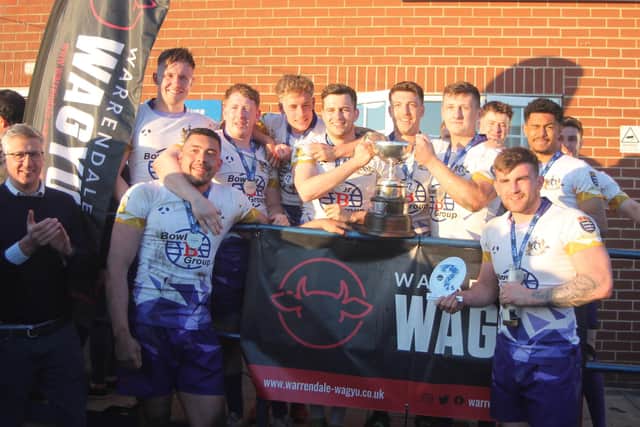 Cleveland Cougars celebrate after receiving the WS Fowler Challenge Trophy from Warrendale Wagyu director Tom Richardson