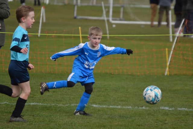 Heslerton Under-Sevens (royal blue) take on Flamborough in the Minor League.