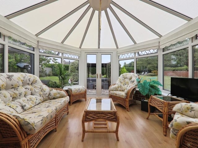 The conservatory, with doors out to the garden.
