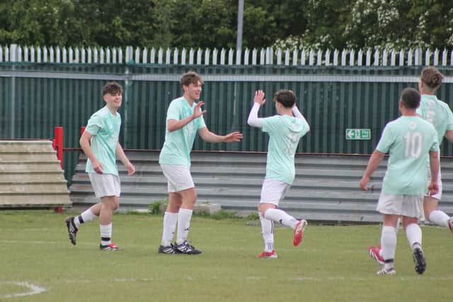 Edgehill hot-shot Kaden Evans celebrates his second goal with Theo Watson in the cup final win against AFC North.