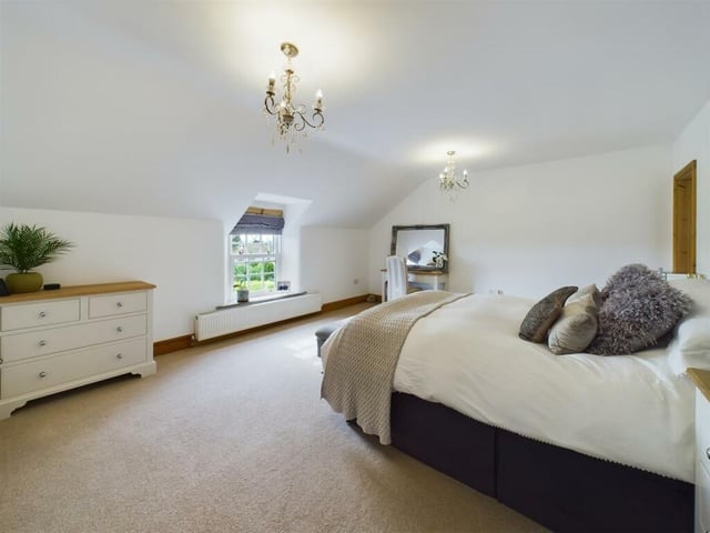 One of the five bedrooms in the former farmhouse.