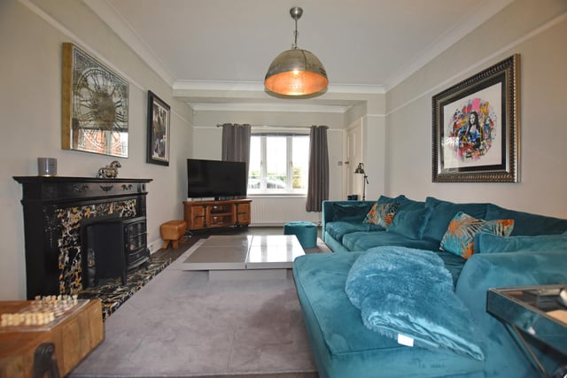The spacious lounge has a central feature fireplace.