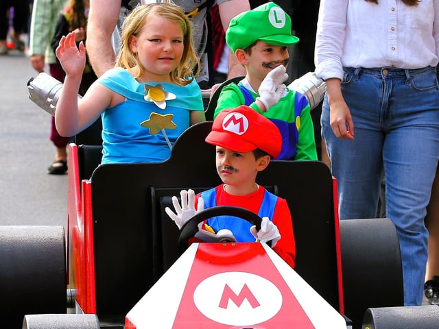 Super Mario characters in the fancy dress.