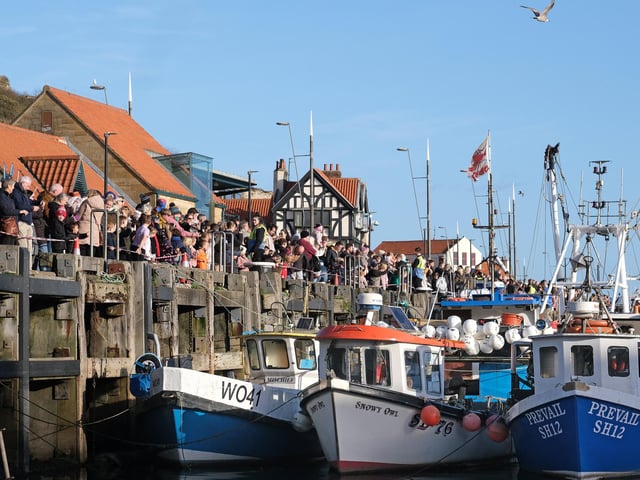 Crowds lined the harbour waiting for the first glimpse of Santa