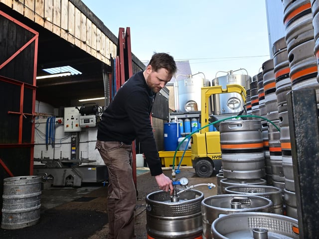 Richard Wells outside with the barrels.