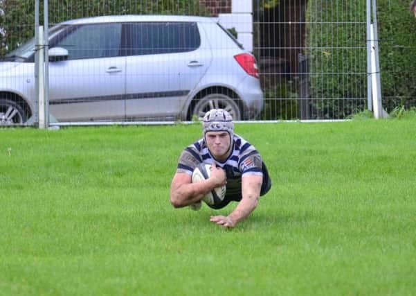 Ed Wraith dives in for Pocklington RUFC's third try against Hullensians in their victory on Saturday afternoon. PHOTO BY ANDY NELSON