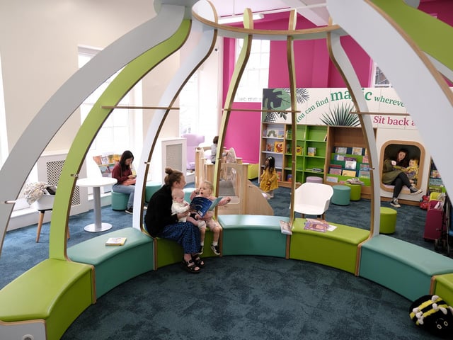 Reading in the brand new, fun children's area!