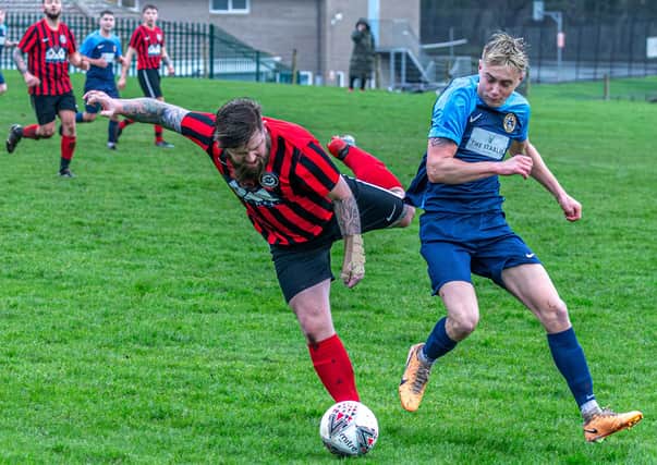Sinnington, red and black kit, won 3-0 at home to Amotherby & Swinton Reserves in Beckett League Division Two on Saturday. PHOTO: BRIAN MURFIELD