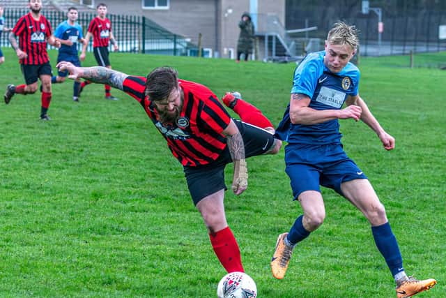 Sinnington, red and black kit, won 3-0 at home to Amotherby & Swinton Reserves in Beckett League Division Two on Saturday. PHOTO: BRIAN MURFIELD