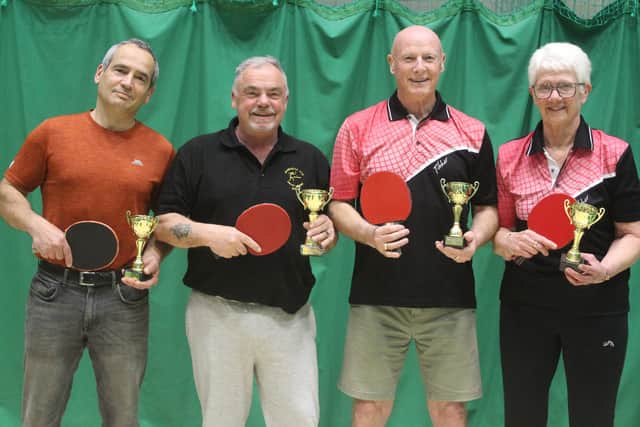 The Crazy Gang are Division One champions, from left, Pier Canta, Gavin Smithies, Paul Wilkinson and Caron Holdsworth. Photo by Tony Wigley