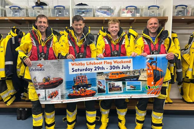 Whitby lifeboat crew promote flag weekend.