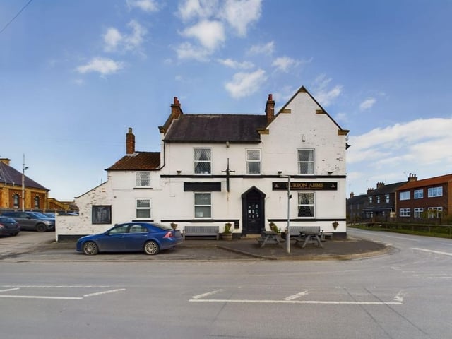 The approach to the village pub and restaurant, The Burton Arms.