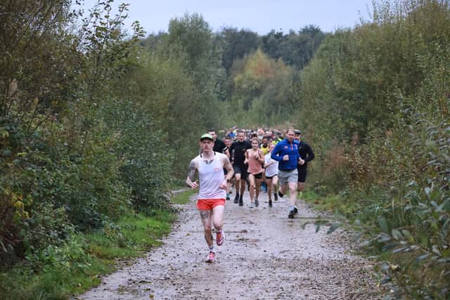 William Anderson leading the way on his way to winning the North Yorkshire Water Park parkrun at Wykeham.