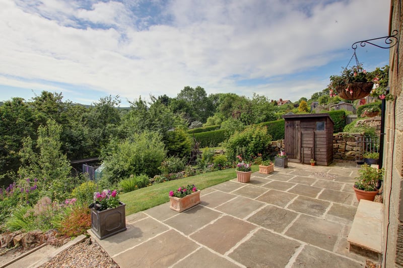 A stone paved patio is accessible from the main house kitchen, and from the apartment living room.