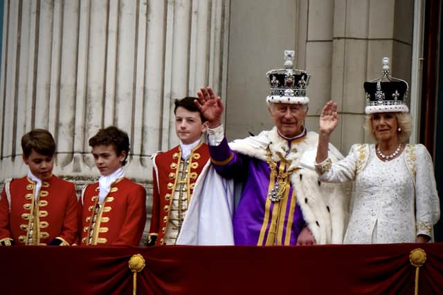 King Charles III & Queen Camilla waving on the Buckingham Palace balcony. Picture: Simon James Smith