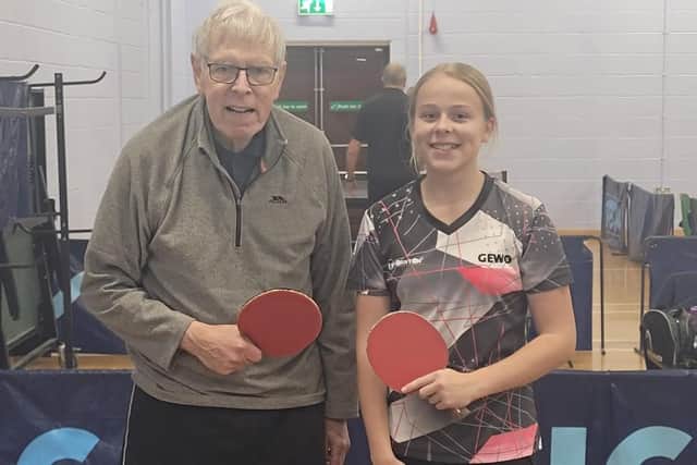 Eighty-one-year-old Mike Fenby played against Phoebe O'Brien, 12.