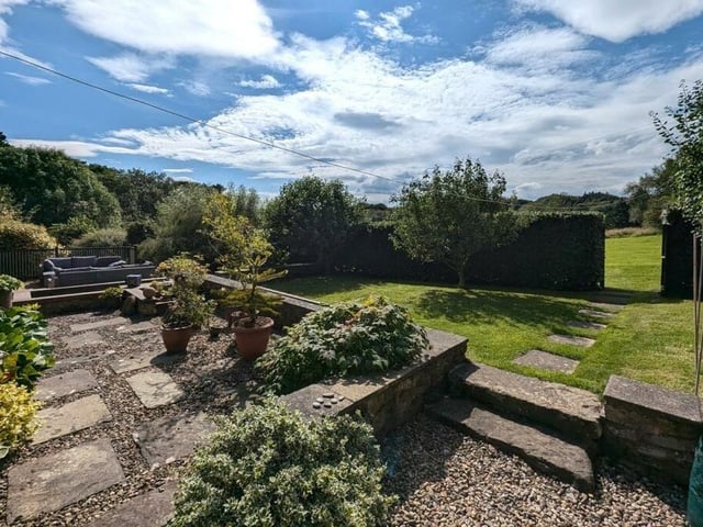 A section of the carefully designed gardens stretching over the 1.5 acres plot.