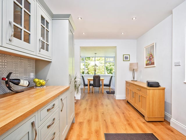 Looking down to the dining room in its pleasant situation with garden view.