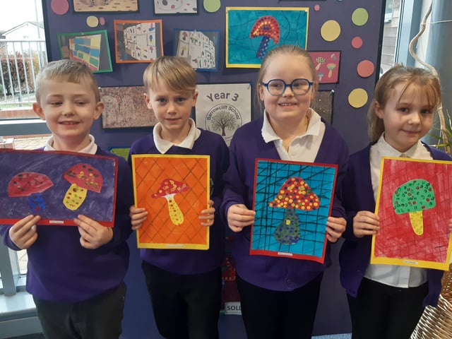 Youngsters with their artwork.