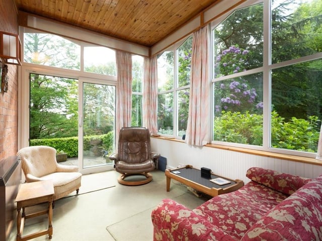The garden room has sliding doors out to the garden.