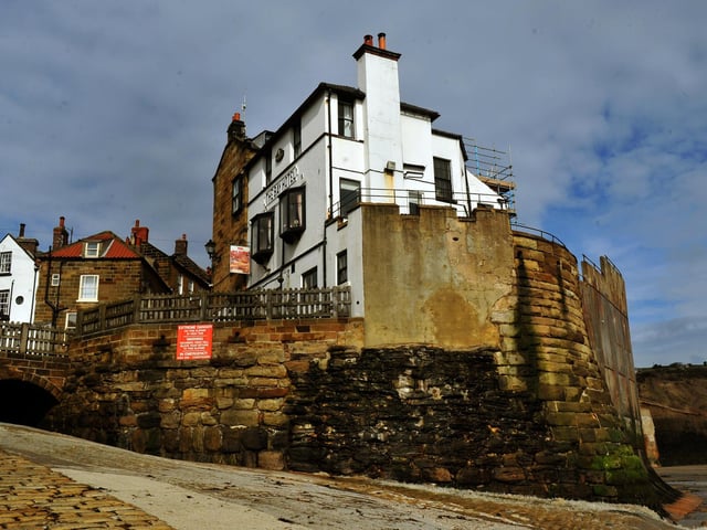 The Bay Hotel dominating the sea wall at Robin Hood's Bay.