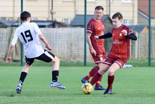 Hull United try to close down a Bridlington Rovers Pandas player.