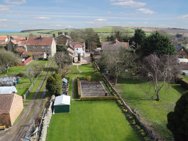 The lawned garden is extensive, and includes a section for vegetable growing.