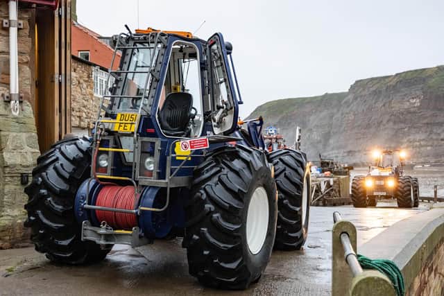 The Staithes and Runswick tractor and relief tractor were brought across the village harbour at low tide.