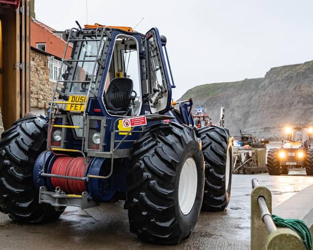 The Staithes and Runswick tractor and relief tractor were brought across the village harbour at low tide.