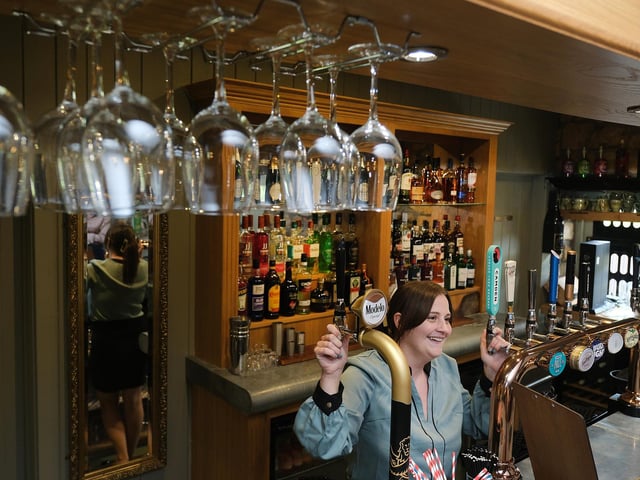 Rachel Naylor working at the bar. photo: Richard Ponter