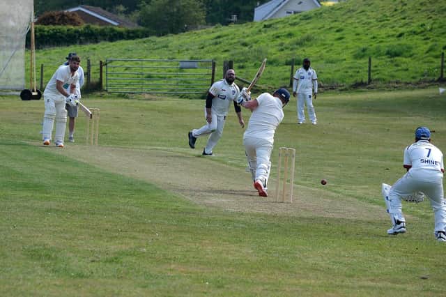 Cloughton batsman Liam Salt hits out during his side's home win against Scarborough Hospital. Photo by Richard Ponter
