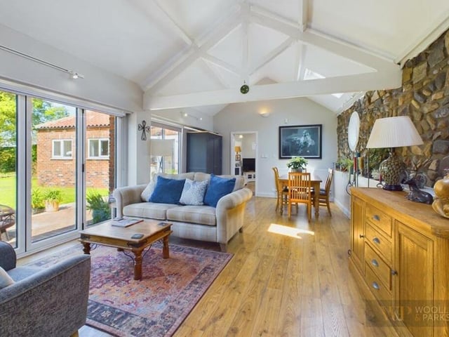 The living and dining space has a vaulted ceiling.