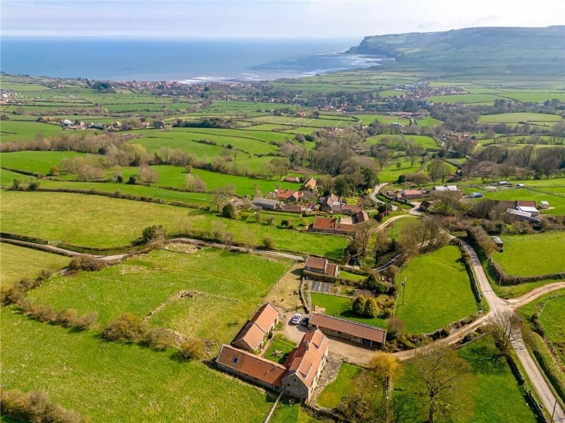 Overview of the property and the surrounding land and seacape.