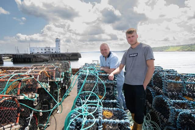 Shaun and Jack Wood from TG Wood, a fish merchant which is based on Scarborough’s West Pier. Photo: North Yorkshire Council.