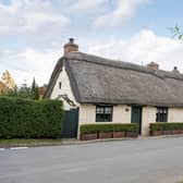 The exterior of the grade ll thatched cottage.