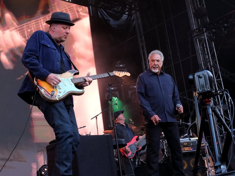 Sir Tom Jones and some of his band-mates on stage.