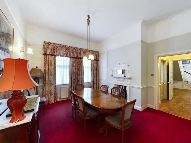 The dining room is situated next to stairs to the first floor.