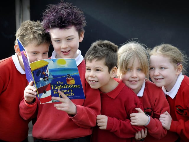 Rillington Primary School pupils Charlie, left, Oliver, Freddie, Georgina, and Megan, enjoy reading The Lighthouse Keeper's Lunch, for World Book Day, 2013.