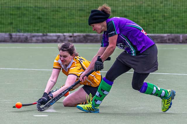 Christine Tarrant tries to regain possession for the home side.
