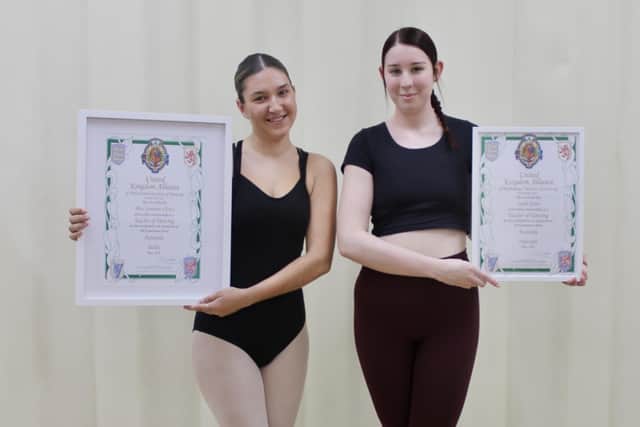 Mia Clews and Leah Storr with their certificates.