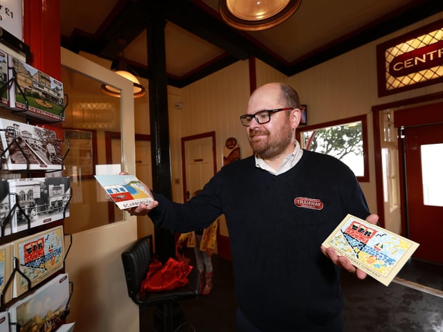Colin prepares the postcards