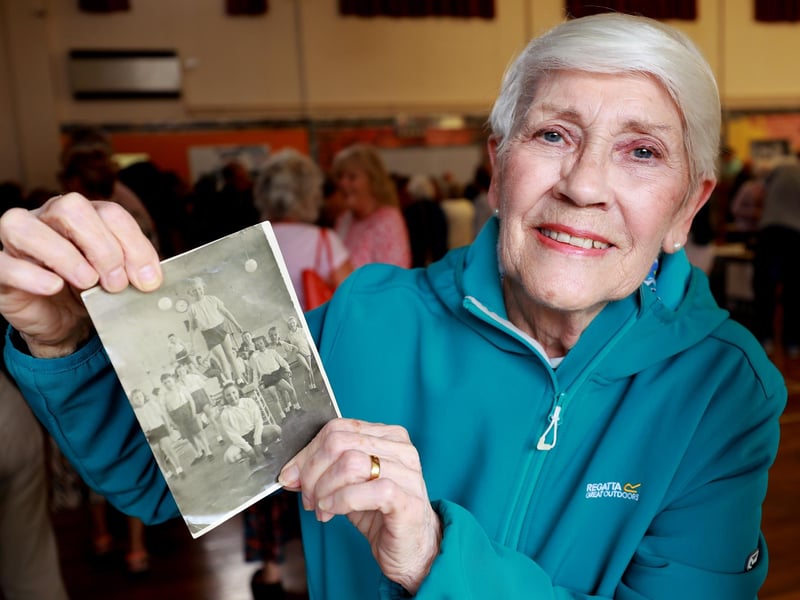 Ann Trencher with her gymnastics picture taken at the school when she attended.