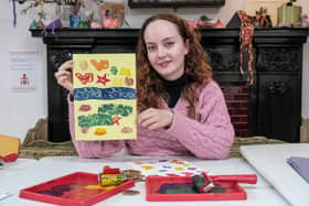 Rhian Roberts, learning officer at Scarborough Museums and Galleries with some of the bright seaside themed posters which can be made during half term activities at Scarborough Art Gallery